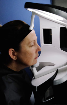 Female patient getting their face scanned by FACTORFIVE's Visa machine