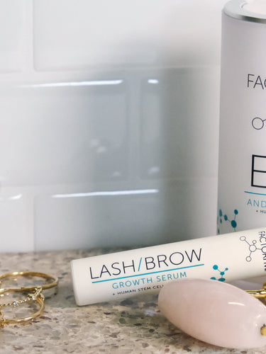 Bathroom with FACTORFIVE Eye & Lash Cream and Lash & Brow Growth Serum products on counter